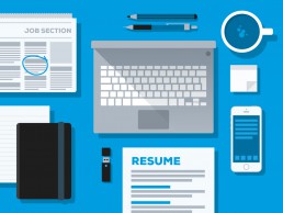 Job Winning Resume cover illustration with selection of resume items on desk